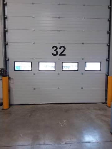 Réparation d’une porte sectionnelle de quai 